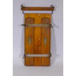 An Edwardian trouser press with metal straps and painted detail, 17" x 31"