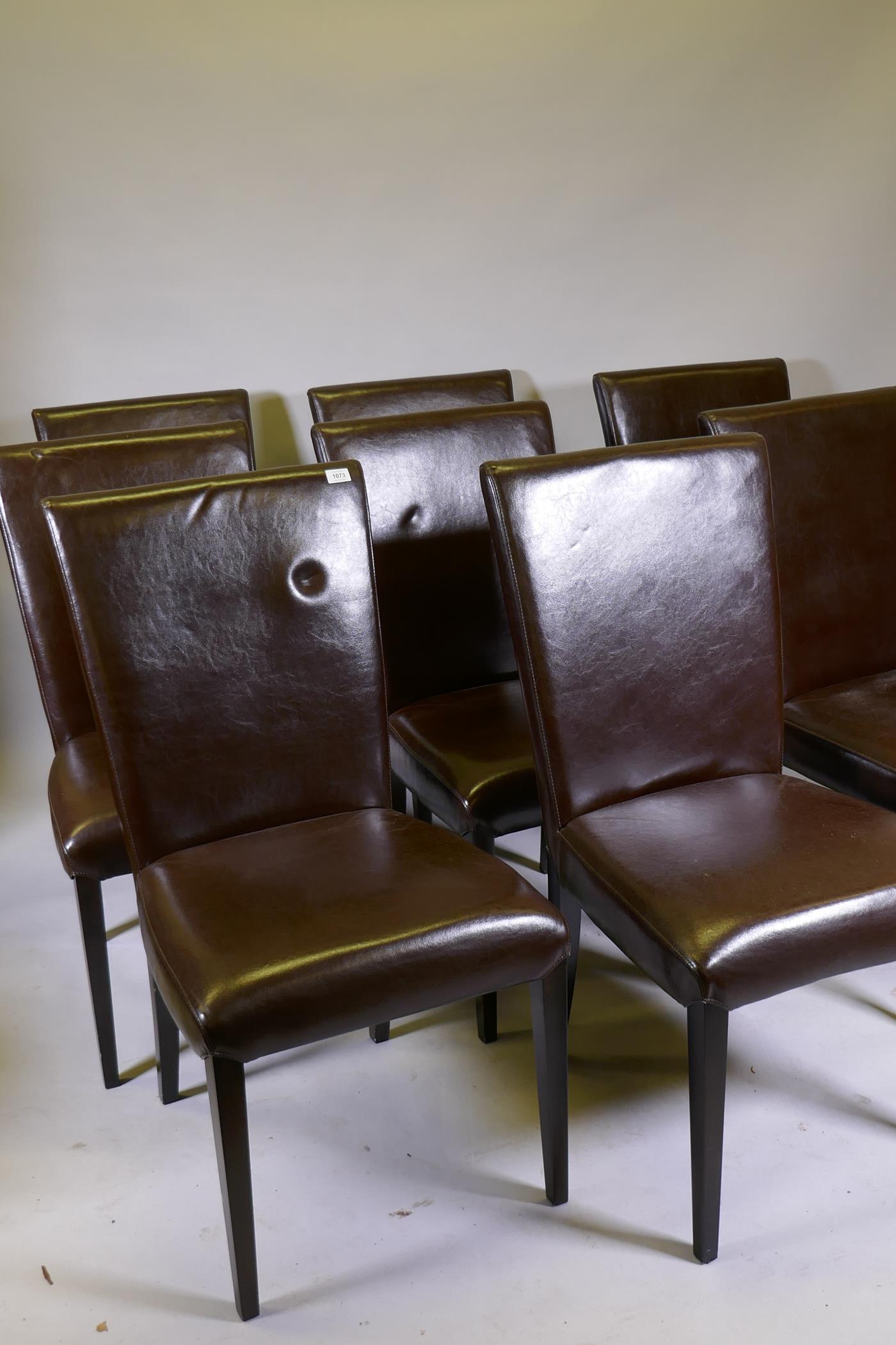A set of eight 'Stone International' brown leather dining chairs
