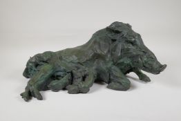 A C20th bronze figure of a wild boar with verdigris patina, signed B.C. Zheng, 18" long