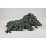 A C20th bronze figure of a wild boar with verdigris patina, signed B.C. Zheng, 18" long