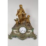A C19th French spelter mantel clock adorned with Baccanalian figures, with twin train movement