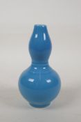 A Chinese blue glazed porcelain double gourd vase, seal mark to base, 6" high