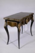 A French Napoleon III style ebonised card table, with brass inlaid decoration and mounts, shaped