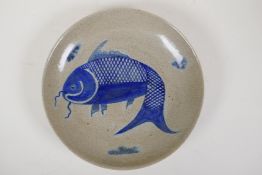 A Chinese crackleware dish with blue and white carp decoration, 10½" diameter