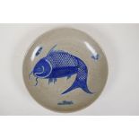 A Chinese crackleware dish with blue and white carp decoration, 10½" diameter