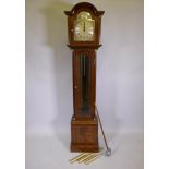A mahogany cased long case clock with Roman numerals to the chapter dial, the German movement