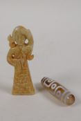 A Tibetan agate dzi bead and a Chinese carved hardstone figure of a priestess, 3" high