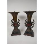 A pair of Japanese bronze and marble lamp bases with embossed gilt panels