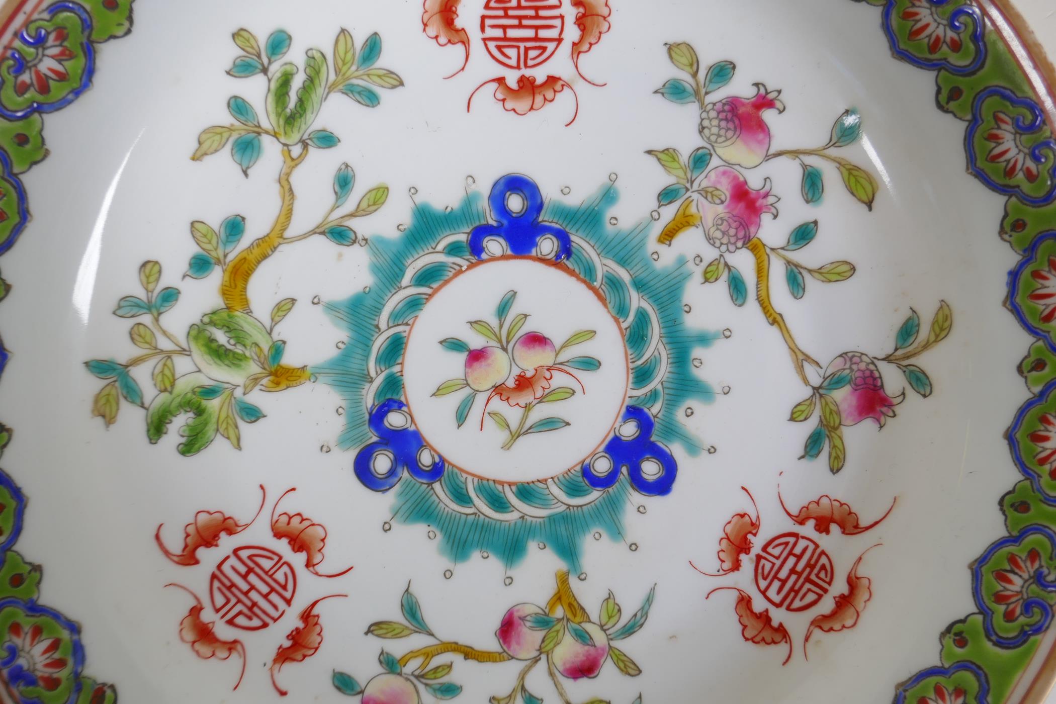 A C19th/C20th polychrome porcelain dish with enamelled decoration of fruits, bats and auspicious - Image 2 of 4