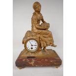 A C19th French spelter cased time piece mantel clock, cast as a lady with a basket of fish and