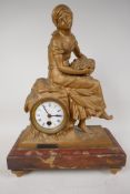 A C19th French spelter cased time piece mantel clock, cast as a lady with a basket of fish and