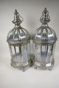 A pair of glass and metal circular garden candle lanterns, 24" high