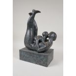 A modernist patinated bronze figure of a mother and child embracing, 12½" high