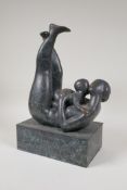 A modernist patinated bronze figure of a mother and child embracing, 12½" high