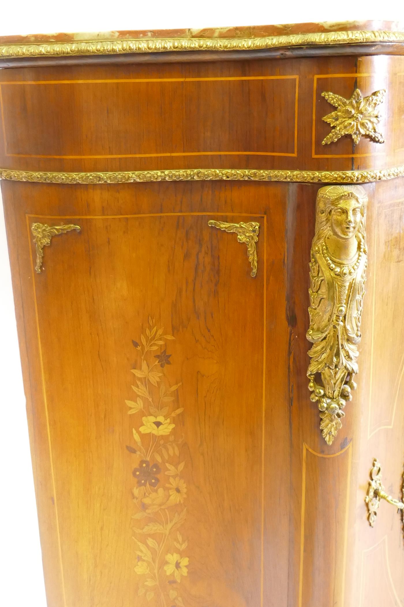 A French marquetry inlaid serpentine front rosewood cabinet with ormolu mounts and marble tops, - Image 4 of 12