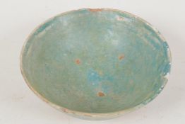 A small Persian earthenware bowl with eggshell blue glaze, 4" diameter