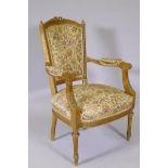 An antique French giltwood open armchair, the shaped back with carved and pierced detail, raised
