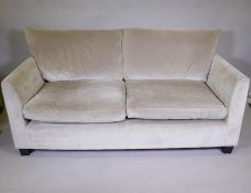 A Kelly Hoppen 'Dorothy' two seater sofa in a silver/grey velvet finish, 70" wide