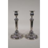 A pair of Empire style silver plated candlesticks, 10" high