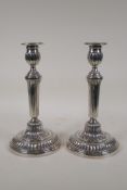 A pair of Empire style silver plated candlesticks, 10" high