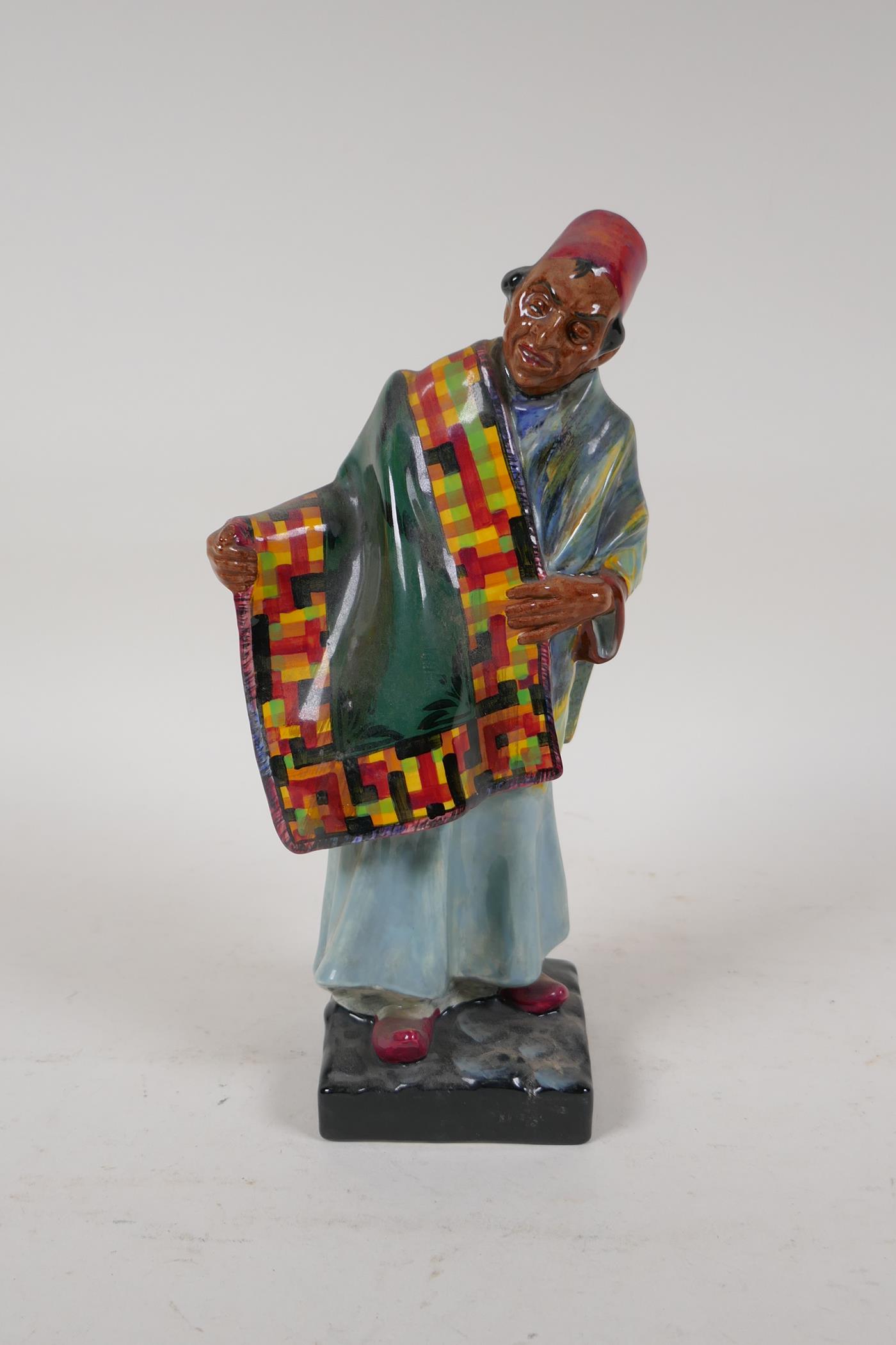 A Royal Doulton figure, Carpet Seller, HN1464, 9" high