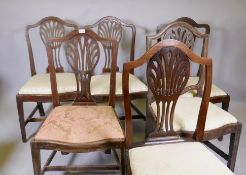 A harlequin set of six mahogany Hepplewhite dining chairs, with shaped backs and pierced splats,