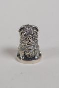 A sterling silver thimble in the form of a dog, 1"