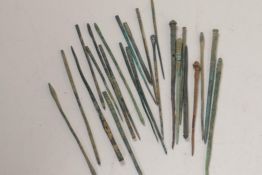 A collection of more than twenty Middle Eastern bronze needles/shroud pins