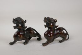 A pair of Chinese bronze kylin, 6½" long