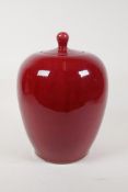 A Chinese flambe glazed porcelain jar and cover, 10½" high