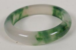 A two colour jade bangle, 2" diameter