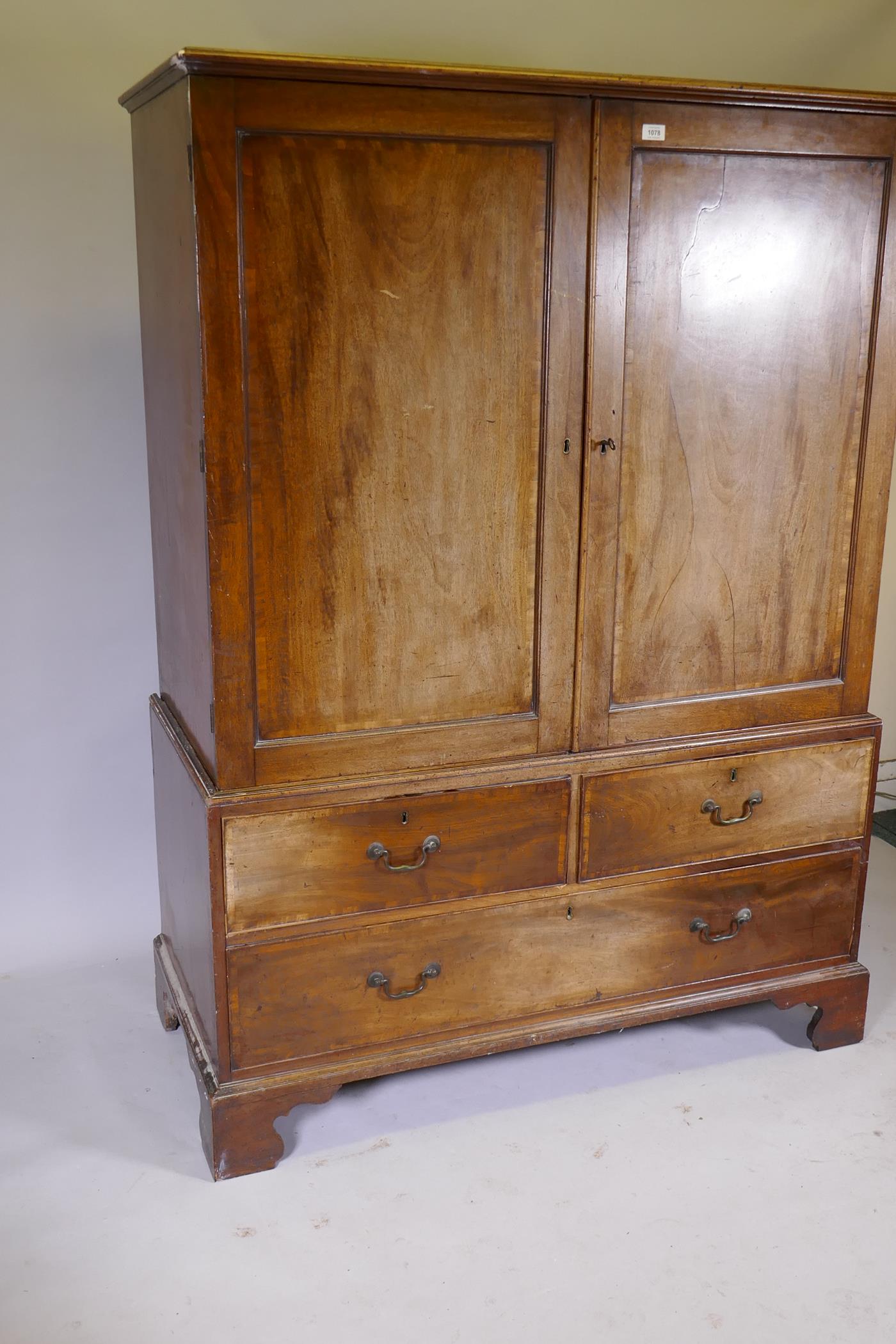 A George III mahogany linen press of small proportions, the doors and drawers with crossbanded inlay - Image 2 of 6