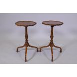 A pair of mahogany wine tables with pie crust tops on turned supports and tripod feet, AF repairs,