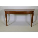 A Georgian mahogany serving table with bow front and square supports, 29½" x 60" x 22"