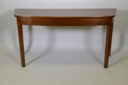 A Georgian mahogany serving table with bow front and square supports, 29½" x 60" x 22"