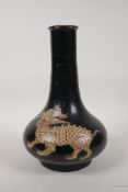 A Chinese Cizhou kiln pottery bottle vase with Kylin decoration, 10½" high