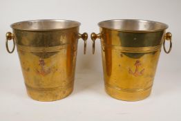 A pair of brass champagne buckets with two ring handles and copper anchor decoration, 8½" high x