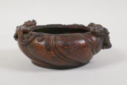 A Chinese bronze censer of lobed form, with two dragon handles and the remains of gilt patina,