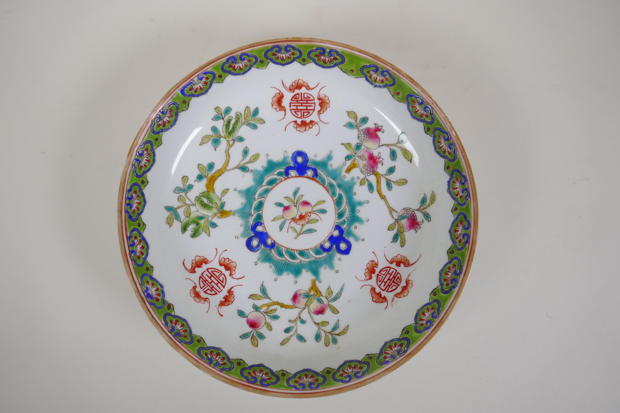 A C19th/C20th polychrome porcelain dish with enamelled decoration of fruits, bats and auspicious