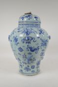 A Chinese blue and white porcelain jar and cover of lobed form, decorated with objets de vertu, 15½"