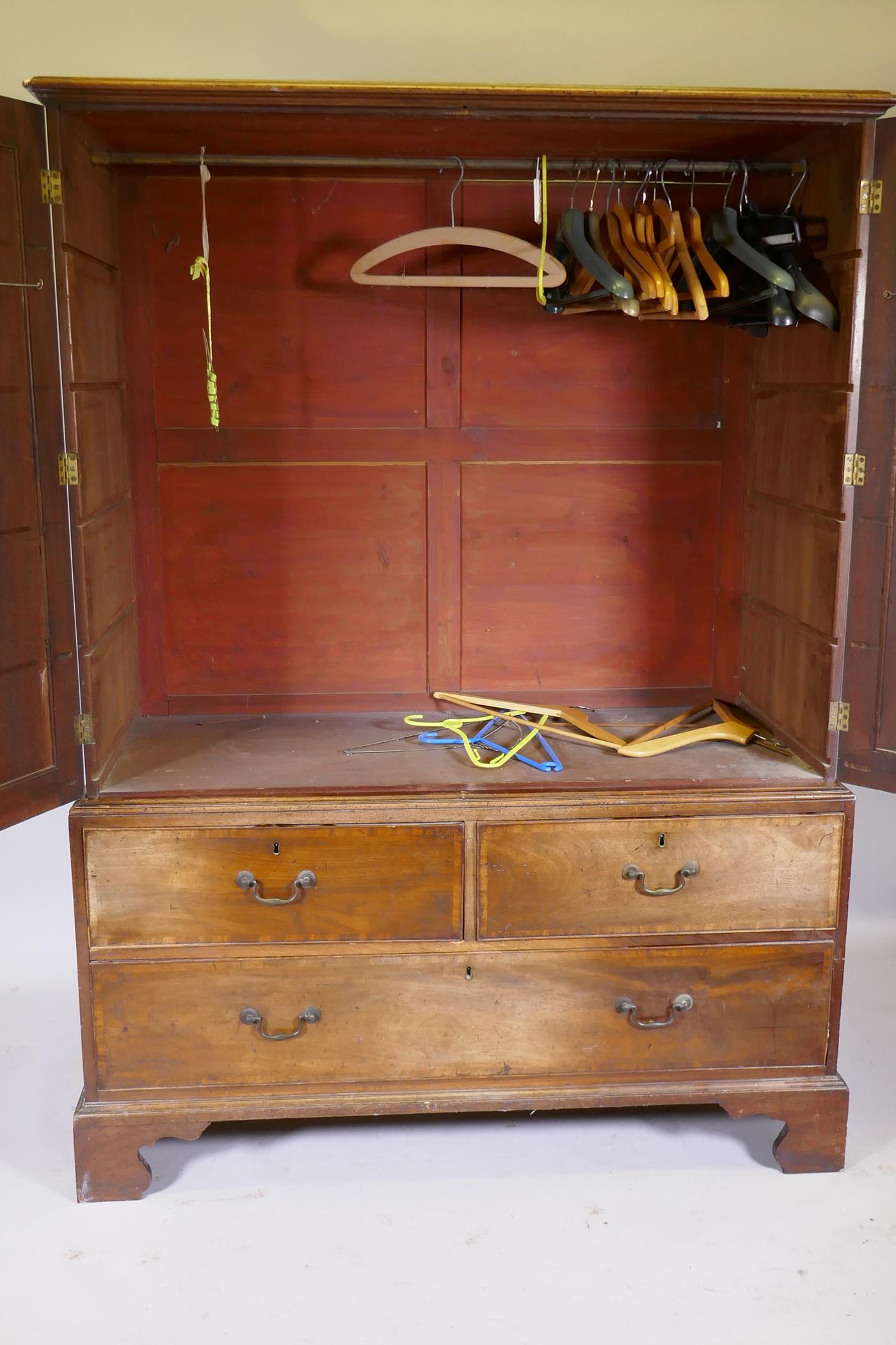 A George III mahogany linen press of small proportions, the doors and drawers with crossbanded inlay - Image 4 of 6