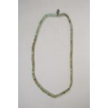 A green jade bead necklace, 27" long