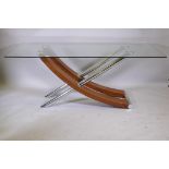 A contemporary glass top dining table, raised on a chrome and walnut finish base, 71" x 36" x 29"