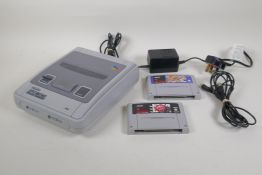 A Super Nintendo Entertainment System, SNES, in working order, with a copy of Street Fighter 2 Turbo