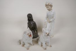 A bronzed composition figure of a young girl, a Nao porcelain figure of a girl in a nightdress,