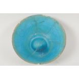 An Islamic pottery conical bowl with scrafito decoration and turquoise blue glaze, 6" diameter, AF