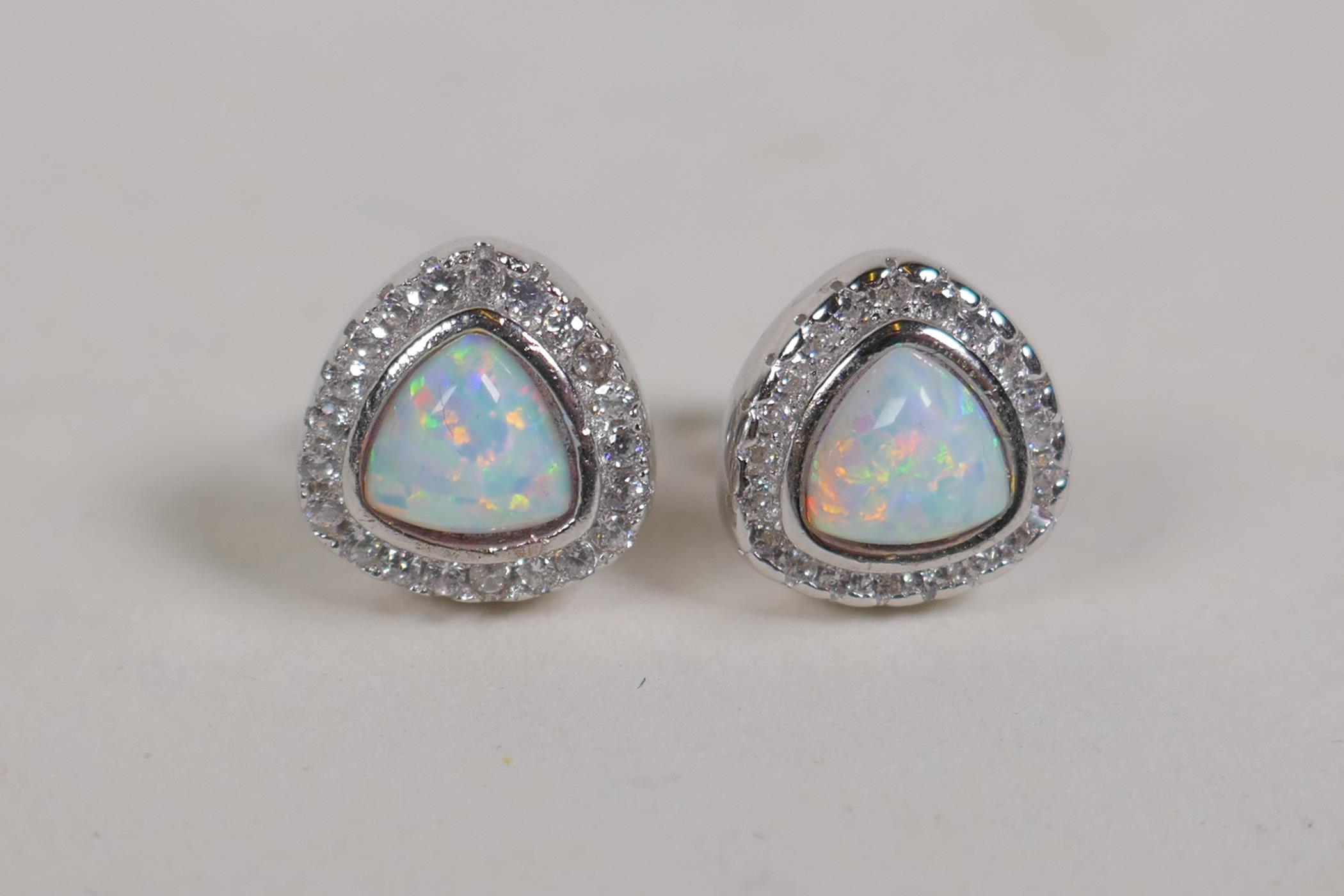 A pair of silver, cubic zirconia and opalite set stud earrings