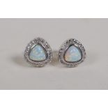 A pair of silver, cubic zirconia and opalite set stud earrings