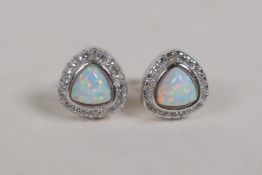 A pair of silver, cubic zirconia and opalite set stud earrings