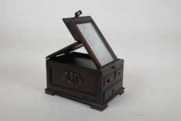 A Chinese hardwood vanity box with brass mounts, 7" x 5"